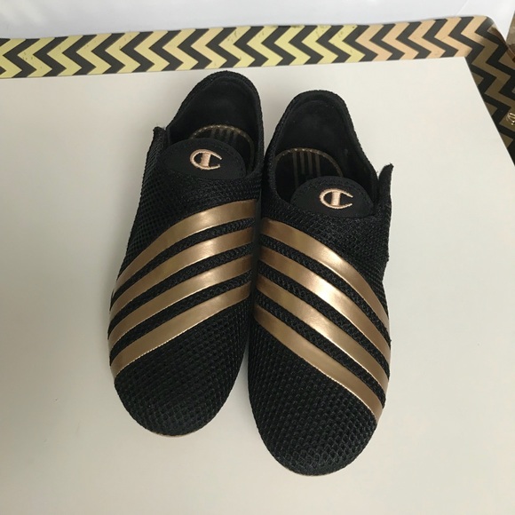 black and gold champion shoes